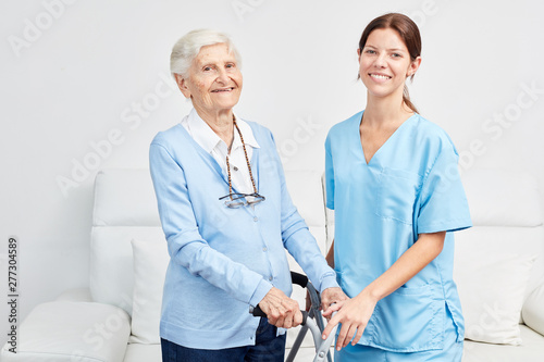 Smiling caregiver with happy elderly woman © Robert Kneschke