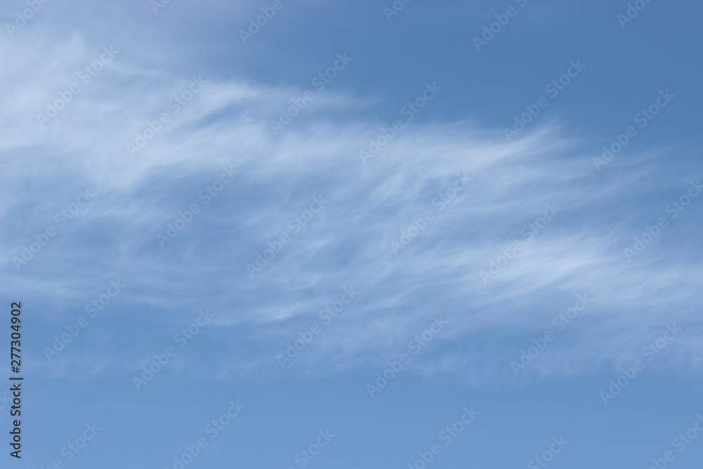 Beautiful feathery clouds in the blue sky Beautiful feathery clouds in the blue sky