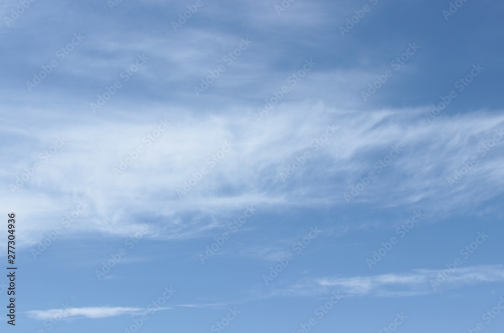 Beautiful feathery clouds in the blue sky Beautiful feathery clouds in the blue sky