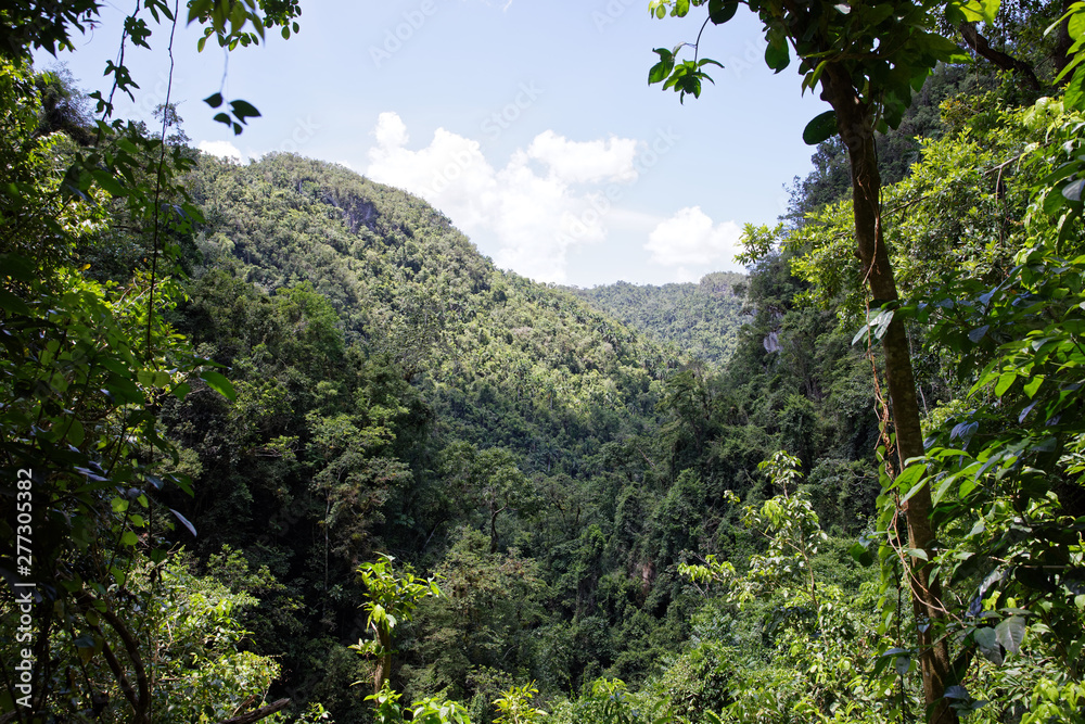 Topes de Collantes, Cuba - July 19, 2018: Beautiful view of the El Nicho valley, an area belonging to the national park Topes de Collantes, Cuba Topes de Collantes, Cuba - July 19, 2018: Beautiful view of the El Nicho valley, an area belonging to the national park Topes de Collantes, Cuba