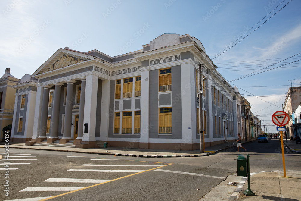 Fototapeta premium Cienfuegos, Cuba - July 26, 2018: City Hall in Jose Marti Park, the UNESCO World Heritage main square of Cienfuegos, Cuba