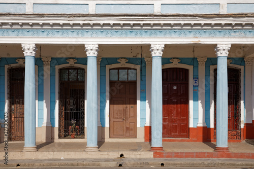 Cienfuegos, Cuba - July 26, 2018: Traditional colonial style colored buildings located on main street Paseo el Prado in Cienfuegos, Cuba © JEROME LABOUYRIE
