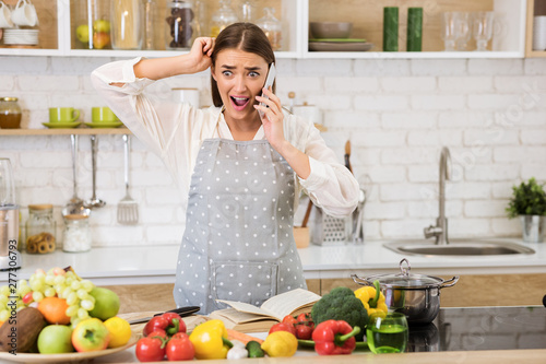 How to cook? Shocked woman talking on phone