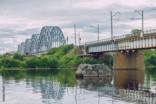 City Riga, Latvia Republic. City railway bridge and old constructions. July 4. 2019 Travel photo.