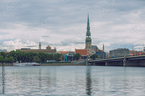 Fototapeta Naklejka Na Ścianę i Meble -  City Riga, Latvia Republic. View to old city and river Daugava. Urban city in summer. July 4. 2019 Travel photo.