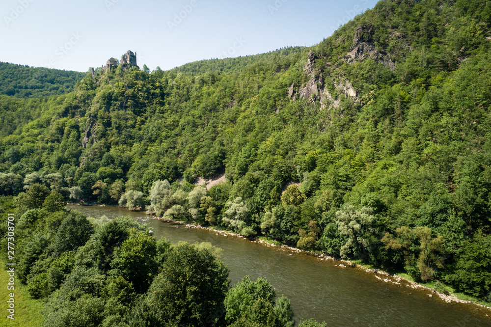 Aerial view of ruins of the Old Strecno castle (Starhrad) and Vah river, Slovak republic