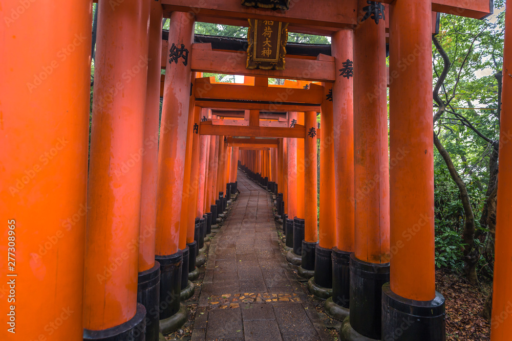 Kyoto - May 28, 2019: Torii gates of the Fushimi Inari Shinto shrine in Kyoto, Japan Kyoto - May 28, 2019: Torii gates of the Fushimi Inari Shinto shrine in Kyoto, Japan
