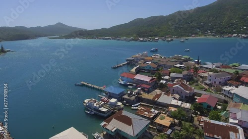 Aerial drone shot of the impressive and picturesque Caribbean island of Guanaja, (Honduras). photo