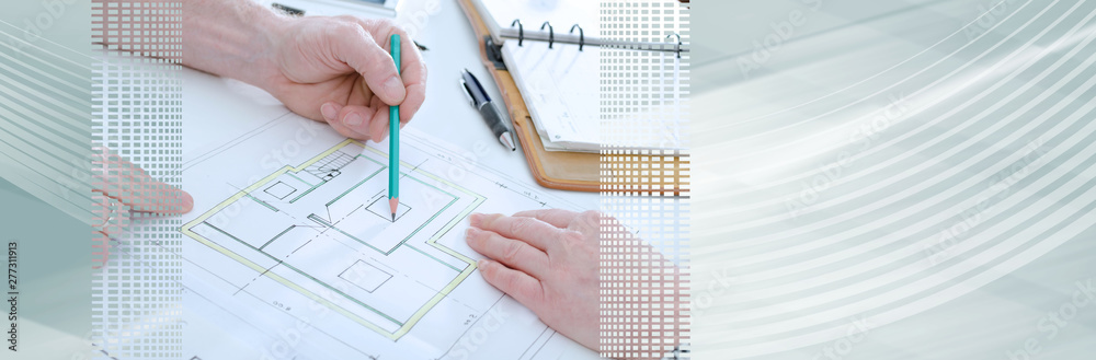 Architect showing house plans; panoramic banner Architect showing house plans; panoramic banner