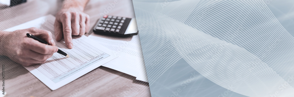 Accountant checking financial document; panoramic banner Accountant checking financial document; panoramic banner