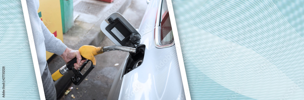Man holding a fuel pump nozzle; panoramic banner