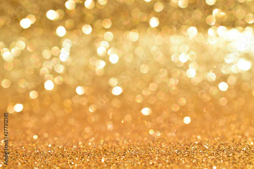 shine and sparkle of golden glitter abstract background 