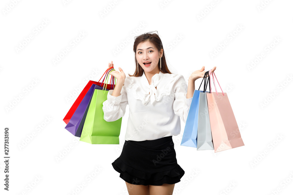 Portrait of an excited beautiful woman holding shopping bags isolated on white background. Portrait of an excited beautiful woman holding shopping bags isolated on white background.