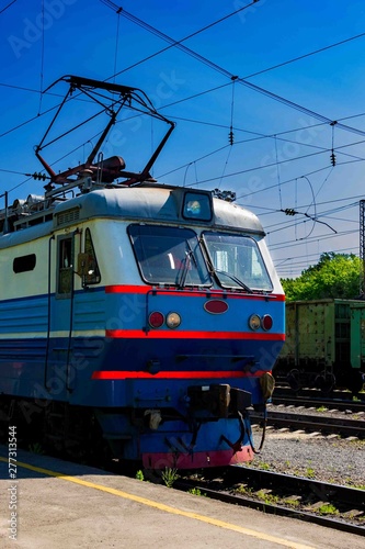Summer.Locomotive goes on rails. Russian train. Russian railway.