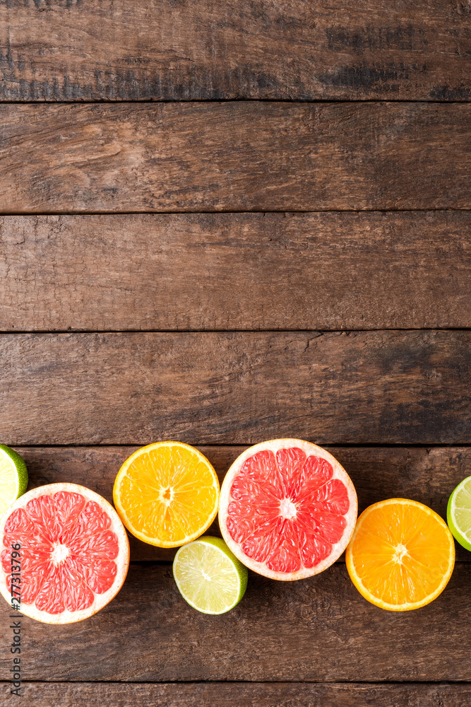 Juicy citruses on wooden table. Top view Juicy citruses on wooden table. Top view
