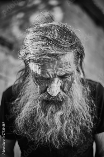 Close-up shot of an old homeless man's face