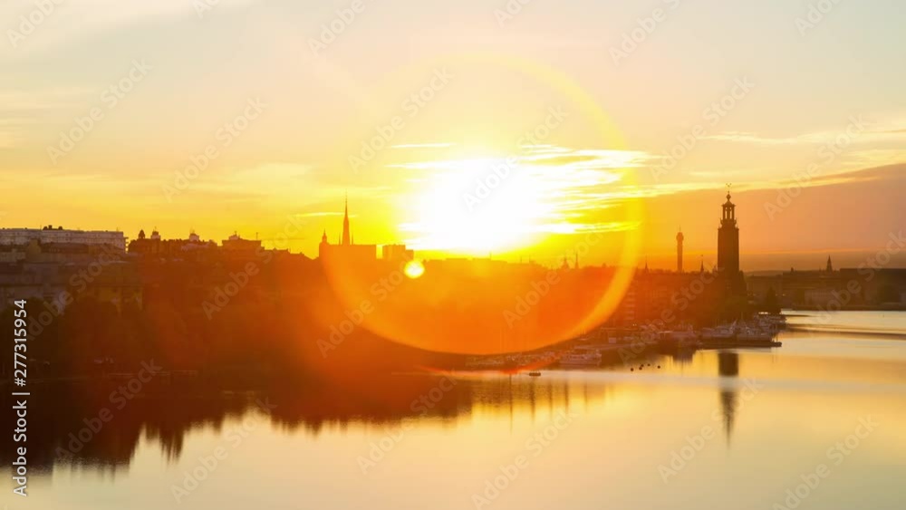 Time lapse of bay Riddarfjarden and The City Hall of Stockholm at sunrise.