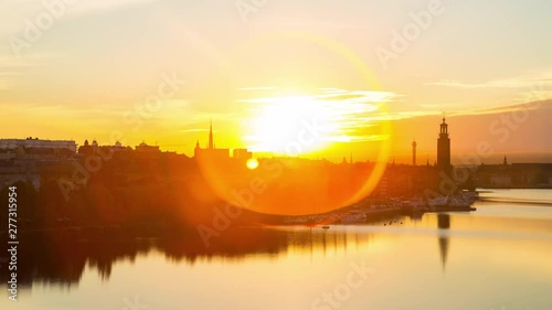 Time lapse of bay Riddarfjarden and The City Hall of Stockholm at sunrise. photo