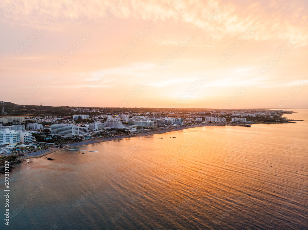 Aerial drone shot of the sunset above Protaras city