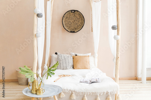 interior room made in white and beige colors in the style of boho