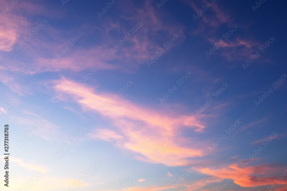 Sunset. Blue sky and pink clouds. Abstract background.