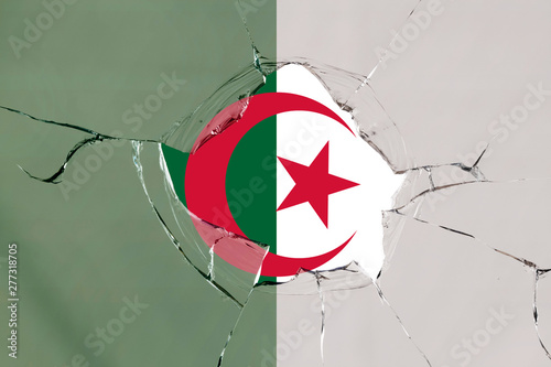 Flag of Algeria on a on glass breakage. photo