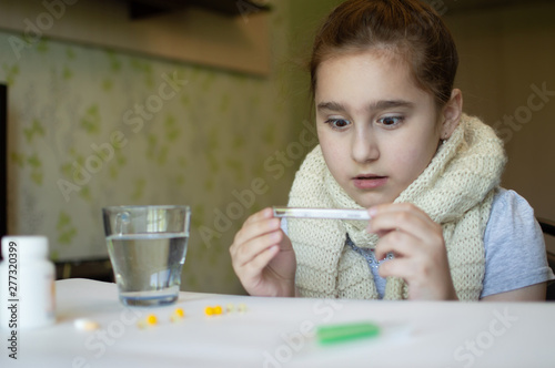 little girl with fever and sneezes