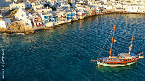 Aerial view of iconic colourful white washed picturesque little Venice in old town of Mykonos island chora, Cyclades, Aegean, Greece © aerial-drone