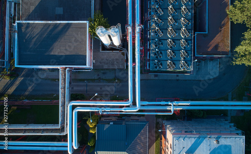 Aerial view of heating plant and its equipment, pipes and coolers. Vertical view. High energy facility providing heat to the big city. photo