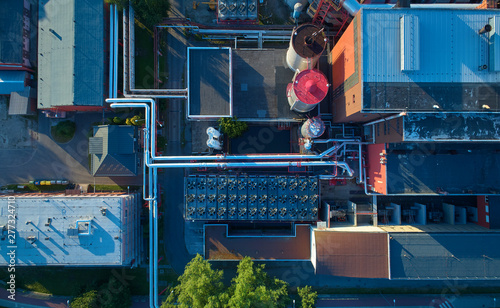 Aerial view of heating plant and its equipment, pipes and coolers. Vertical view. High energy facility providing heat to the big city. photo