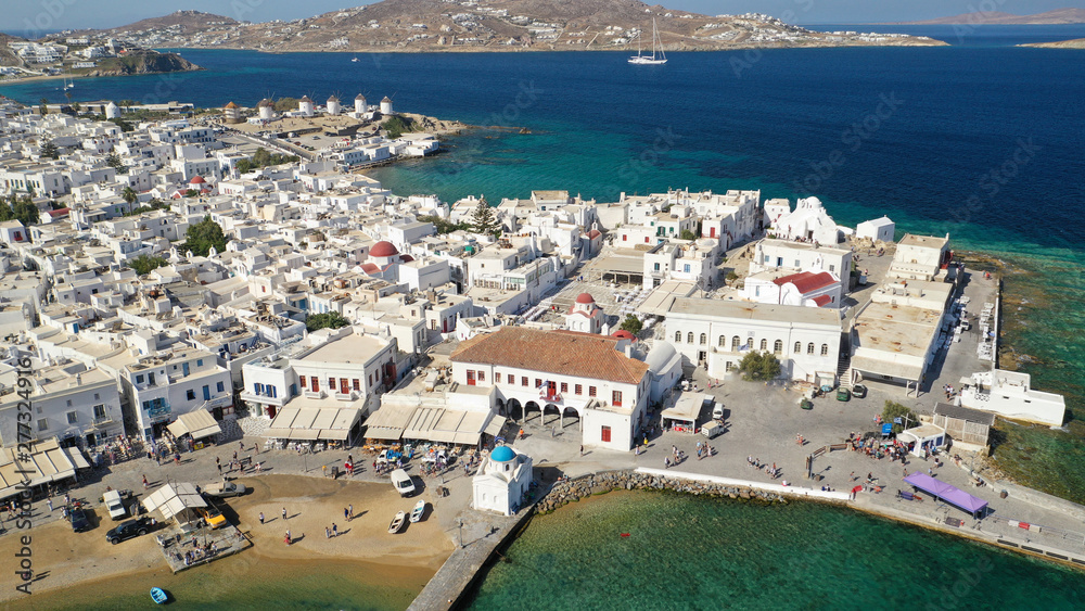 Obraz premium Aerial drone photo of picturesque and beautiful whitewashed old port in main town of Mykonos island, Cyclades, Greece