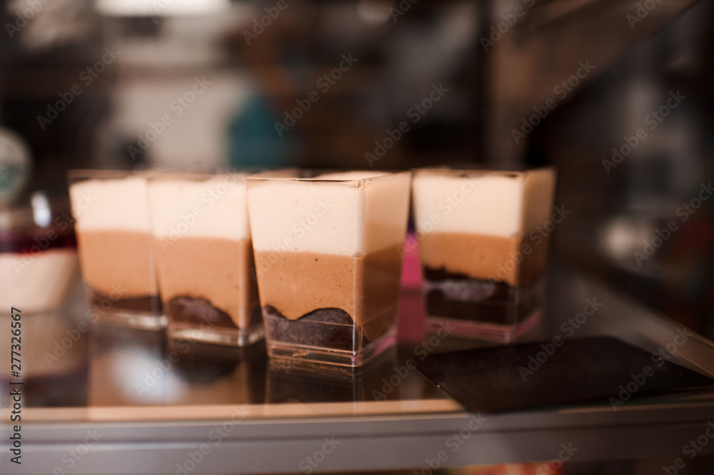 Chocolate cakes in show window closeup. Chocolate cakes in show window closeup.
