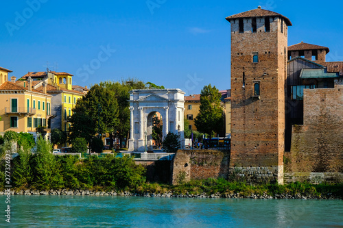 Verona, Italy: View on embankment of Adige river with ancient roman arch Arco dei Gavi. photo