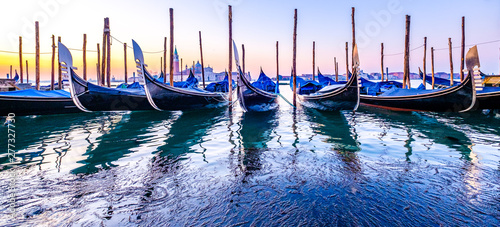 typical gondolas in venice - italy photo