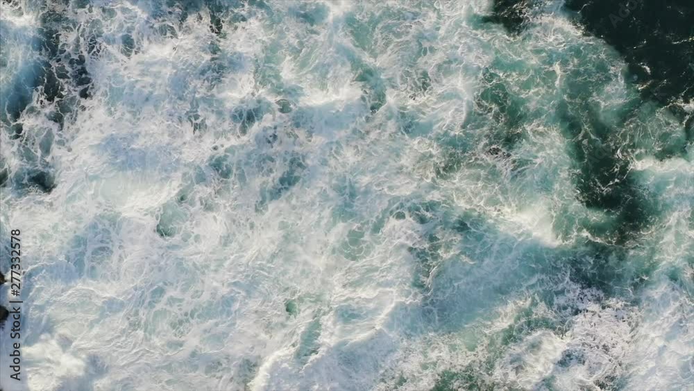 Top aerial slow motion view of surge ocean, beautiful foamy ocean waves Top aerial slow motion view of surge ocean, beautiful foamy ocean waves