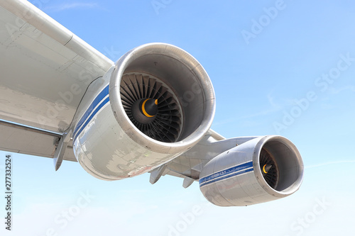 Airplane wing with two aircraft engines in flight