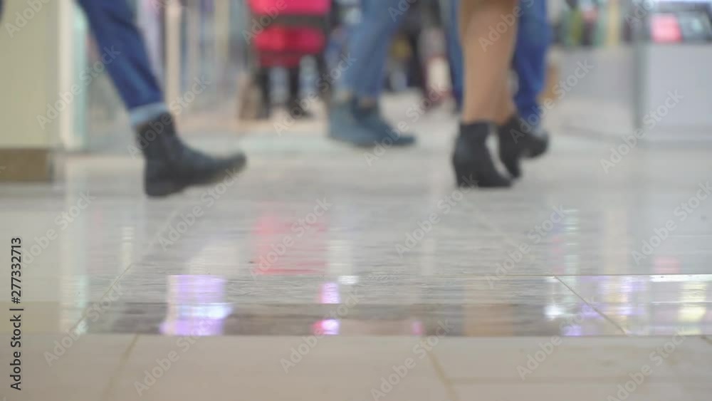Legs of people walking in crowd. Close-up and shallow depth of field scene. Legs of people walking in crowd. Close-up and shallow depth of field scene.
