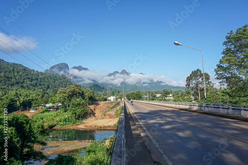 The destination of the road is a foggy mountain road to Pilok Village, Kanchanaburi Province, Thailand.