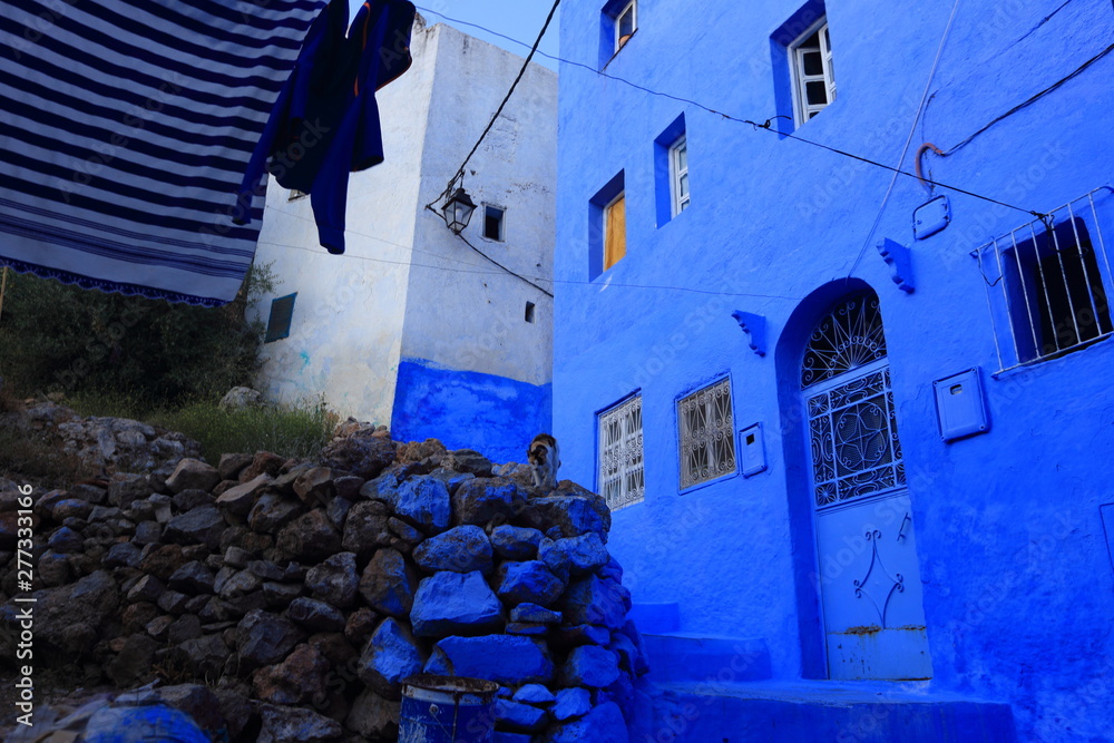 Blue street walls of the popular city of Morocco, Chefchaouen. Traditional moroccan architectural details.