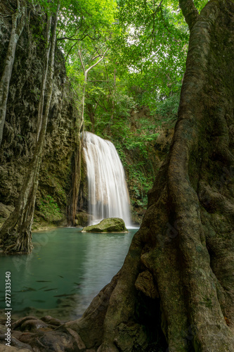 Clean green emerald water from the waterfall Surrounded by small trees - large trees   green colour  Erawan waterfall  Kanchanaburi province  Thailand