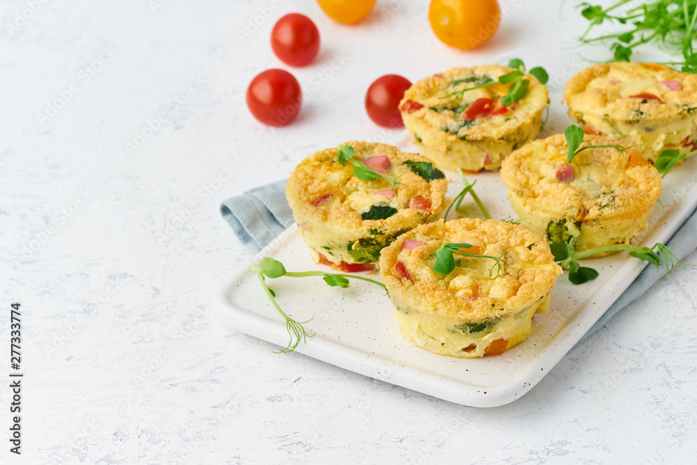 omelet with tomatoes and bacon, baked eggs with spinach and broccoli, closeup with copy space, keto, ketogenic diet omelet with tomatoes and bacon, baked eggs with spinach and broccoli, closeup with copy space, keto, ketogenic diet