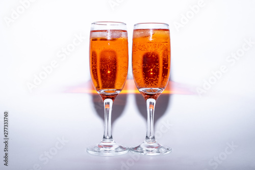 glass of sweet cocktail aperol Spritz with ice on white background