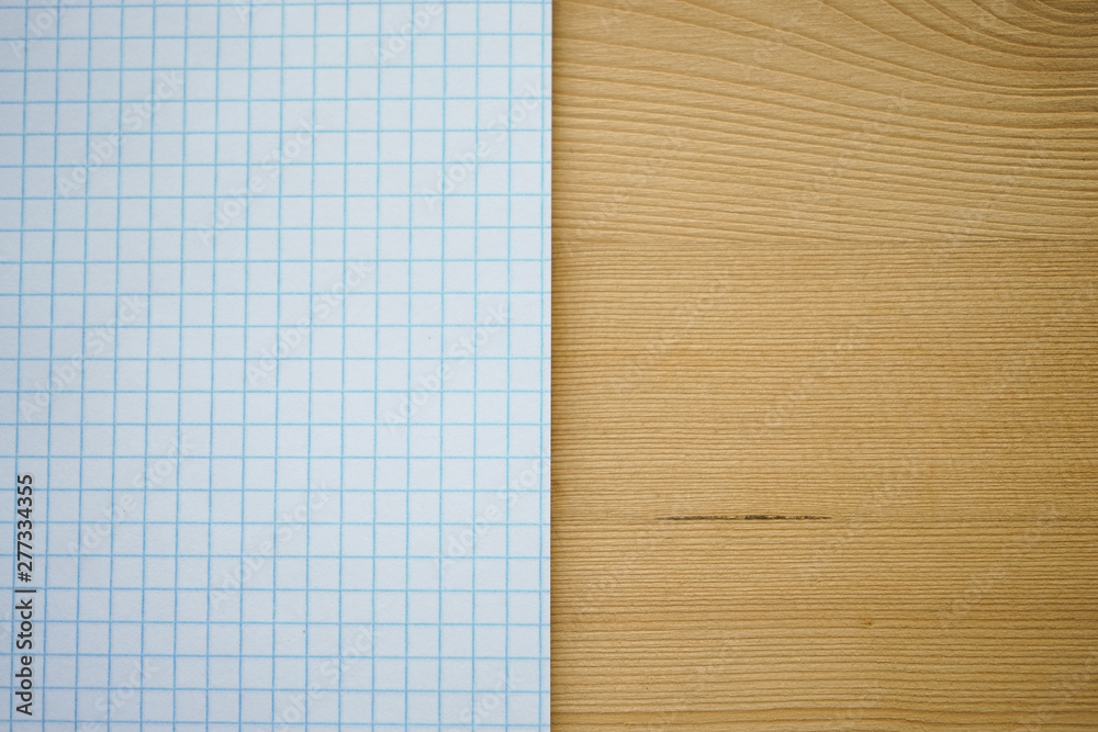 selective focus, a stack of blank paper in a cage from a school notebook , a place for text selective focus, a stack of blank paper in a cage from a school notebook , a place for text