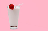 Strawberry cocktail or milk shake in a glass decorated with strawberries on the table. Healthy food for breakfast and snacks.