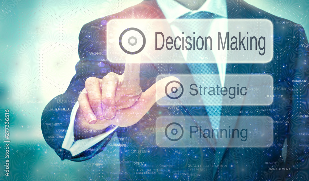 A businessman selecting a button on a futuristic display with a Decision Making concept written on it. A businessman selecting a button on a futuristic display with a Decision Making concept written on it.