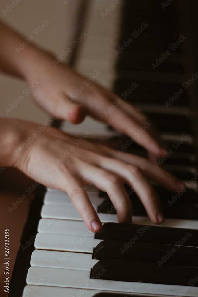 Fototapeta premium hands playing piano