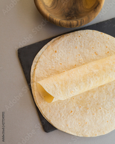 Thin crepes on stone slate, close-up