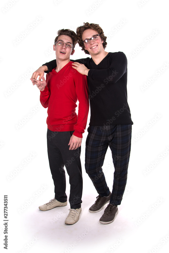 Two fun attractive students. White background. Study. Two fun attractive students. White background. Study.