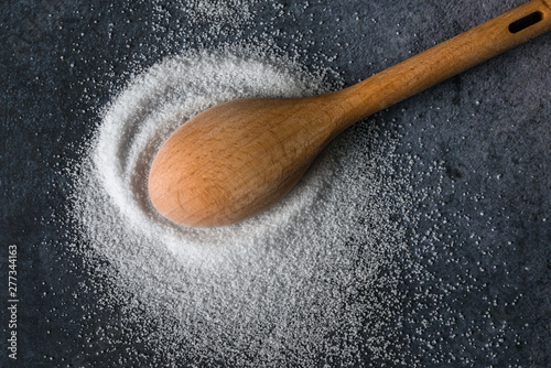 Fotografie Citric Acid Spilled from a Teaspoon