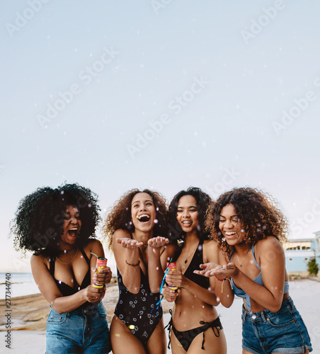 Girls celebrating on beach